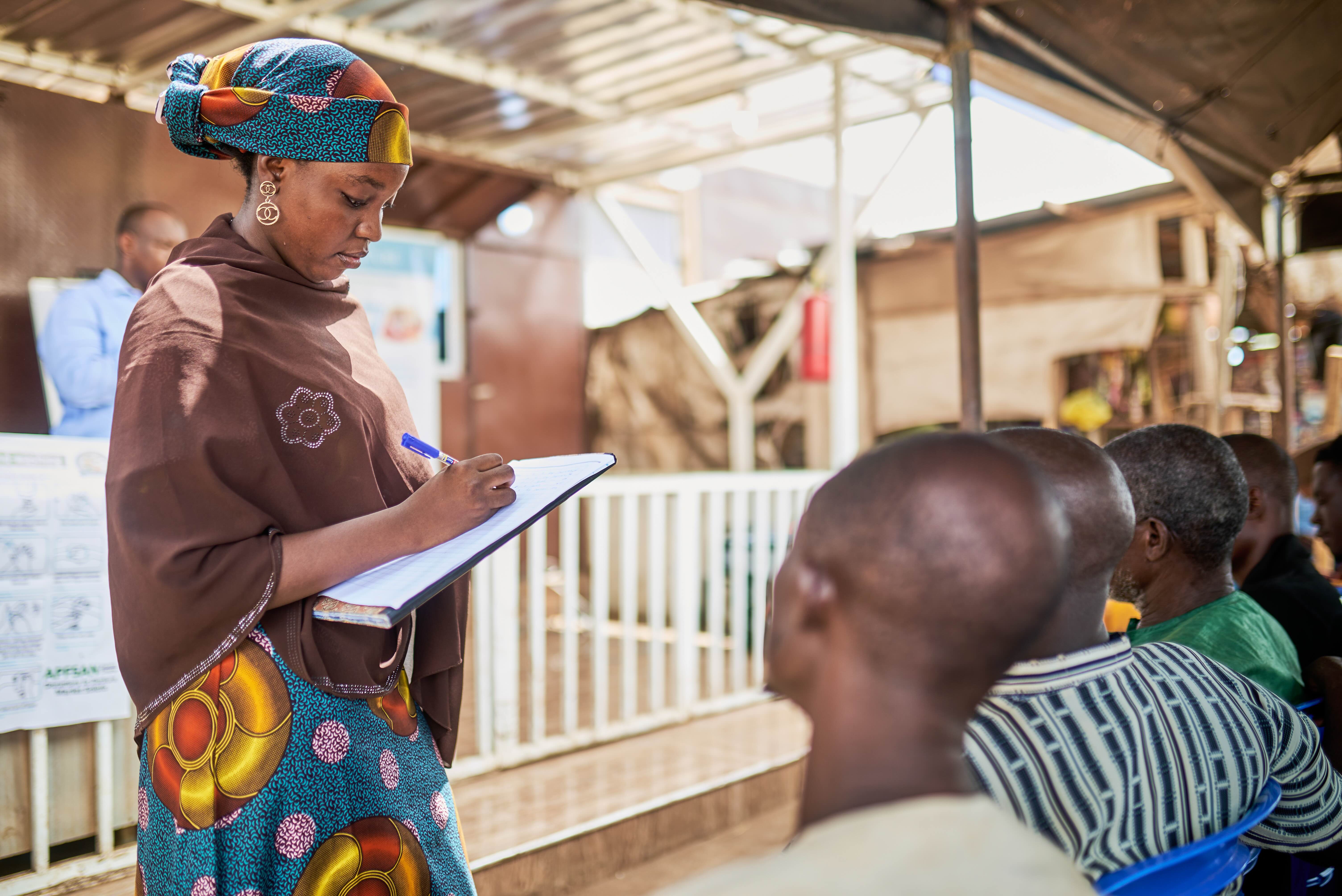 A woman writing during a group session