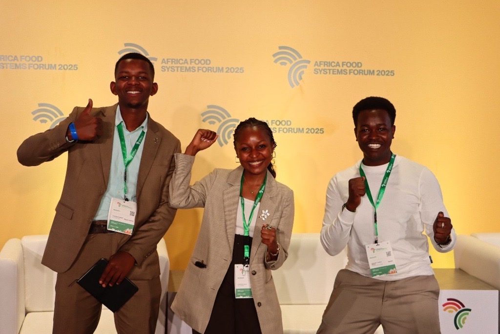 Three young food systems advocates at the Africa Food Systems Forum 2025