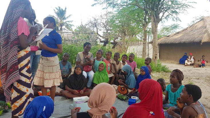 Children and facilitators participating in a Heroes Journey nutrition activity