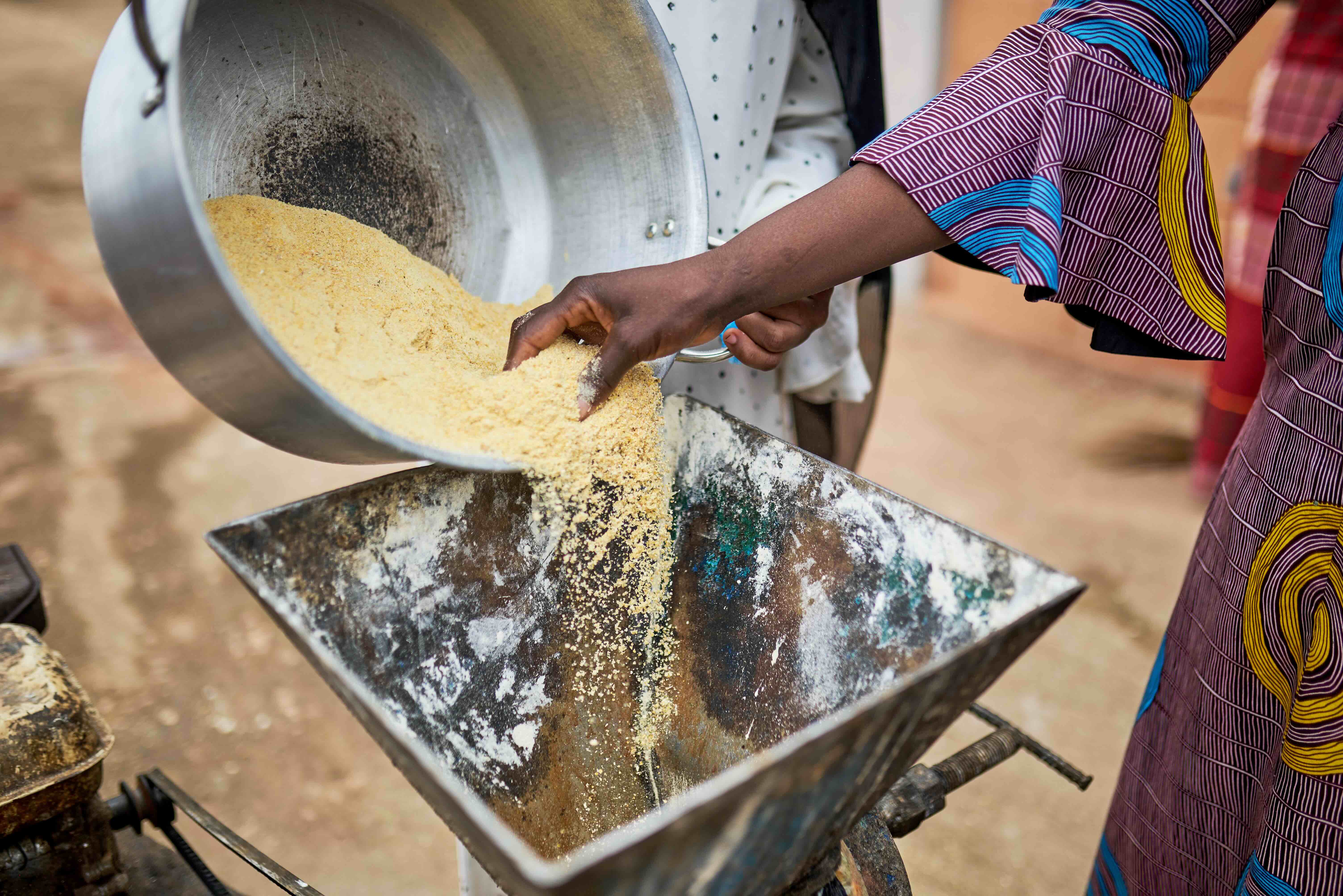 woman processing maize