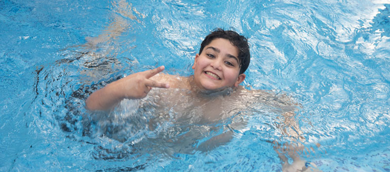 Child swimming in the pool