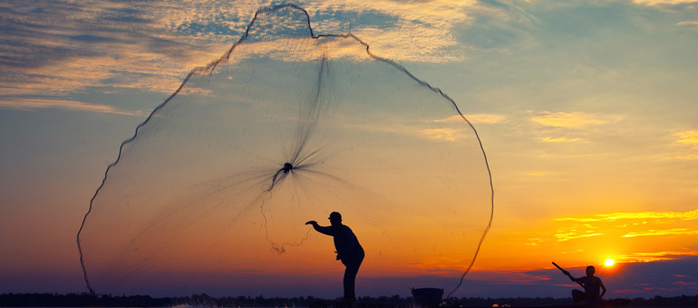 Fisherman throwing the net