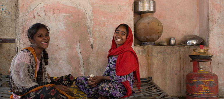 Girls smiling and playing in India