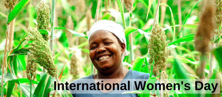 Woman smiling warmly in a crop field