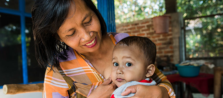 Woman breastfeeding her child in Indonesia