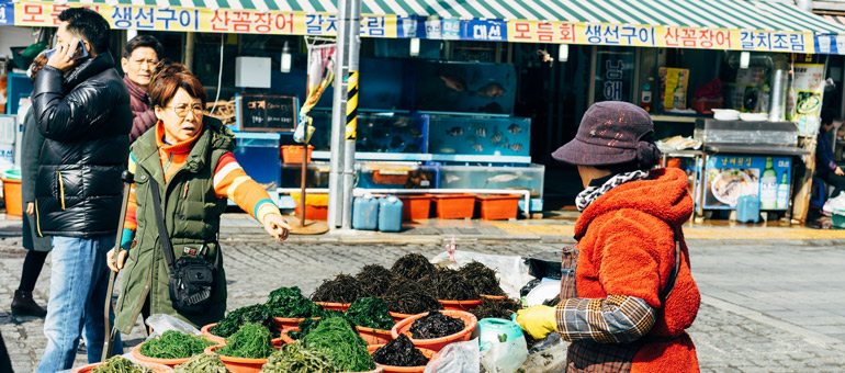 Woman buying food in the streets