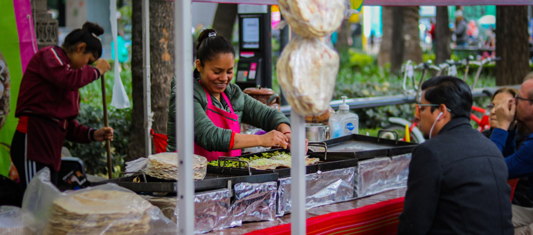 Woman cooking and man watching