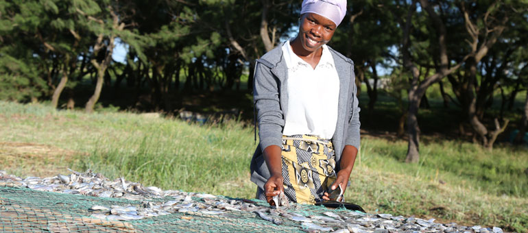 Woman sorting fish in Mozambique