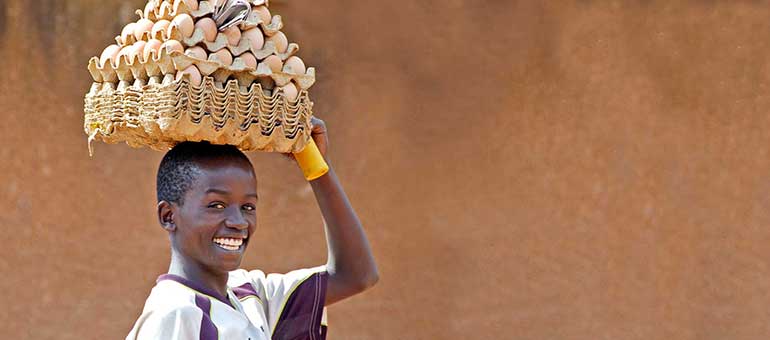 Adolescent carrying eggs in Africa