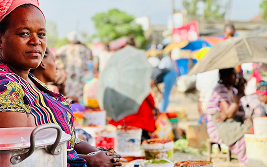 a women at an Ethiopian market looking directly to camera