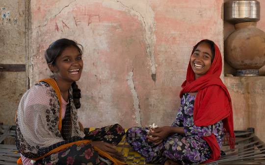 Girls smiling and playing in India