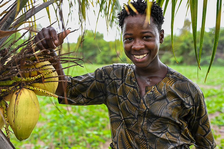 Young agrifood innovator displaying crops