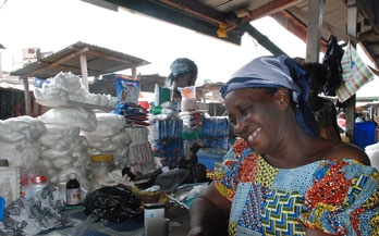 Woman packing salt in a market