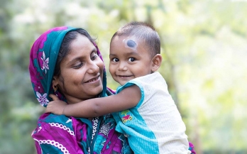 A mother holding her child in Bangladesh