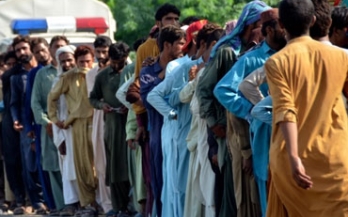 Long queue of people on the road