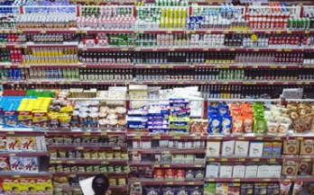 Woman in front of supermarket shelves Woman in front of supermarket shelves