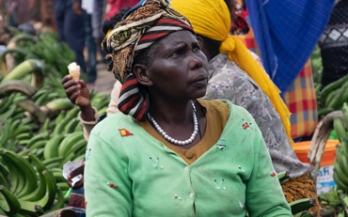 Woman selling bananas and wearing a green top in Tanzania Woman selling bananas and wearing a green top in Tanzania