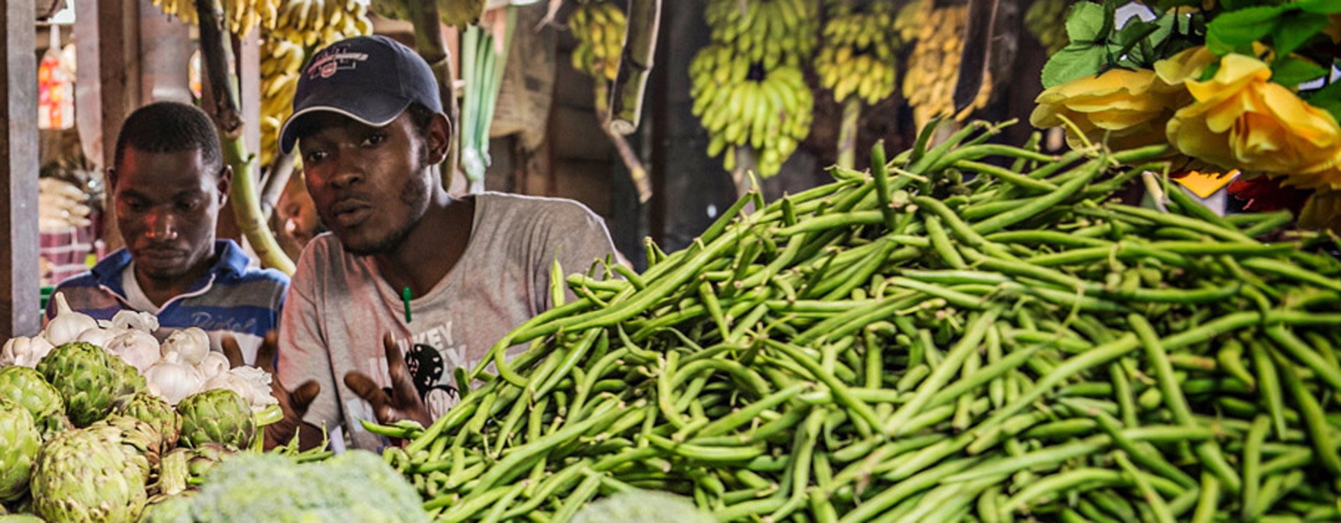 Two men selling vegetables in Tanzania
