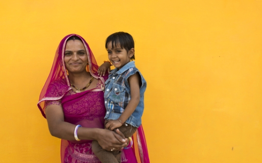 A lady and her son smiling