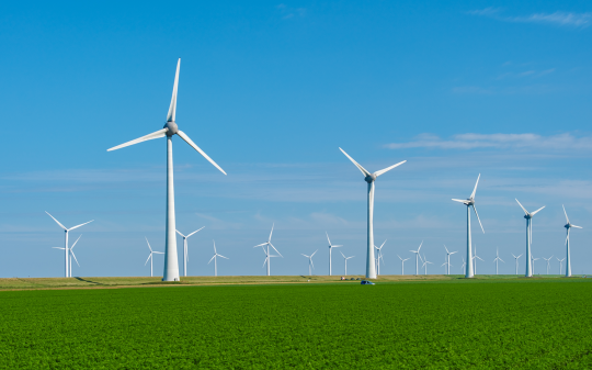 sustainable-wind-power-generation-amidst-lush-field