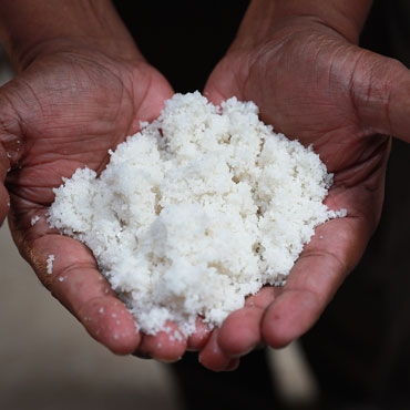 Hands holding and showing salt