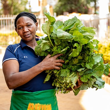 Woman holding vegetables