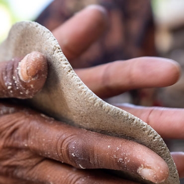 Hands prepping pancakes