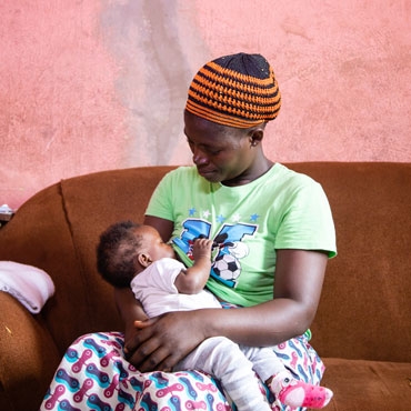 Woman breastfeeding her baby in Kenya