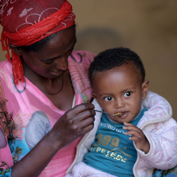 Woman feeding baby